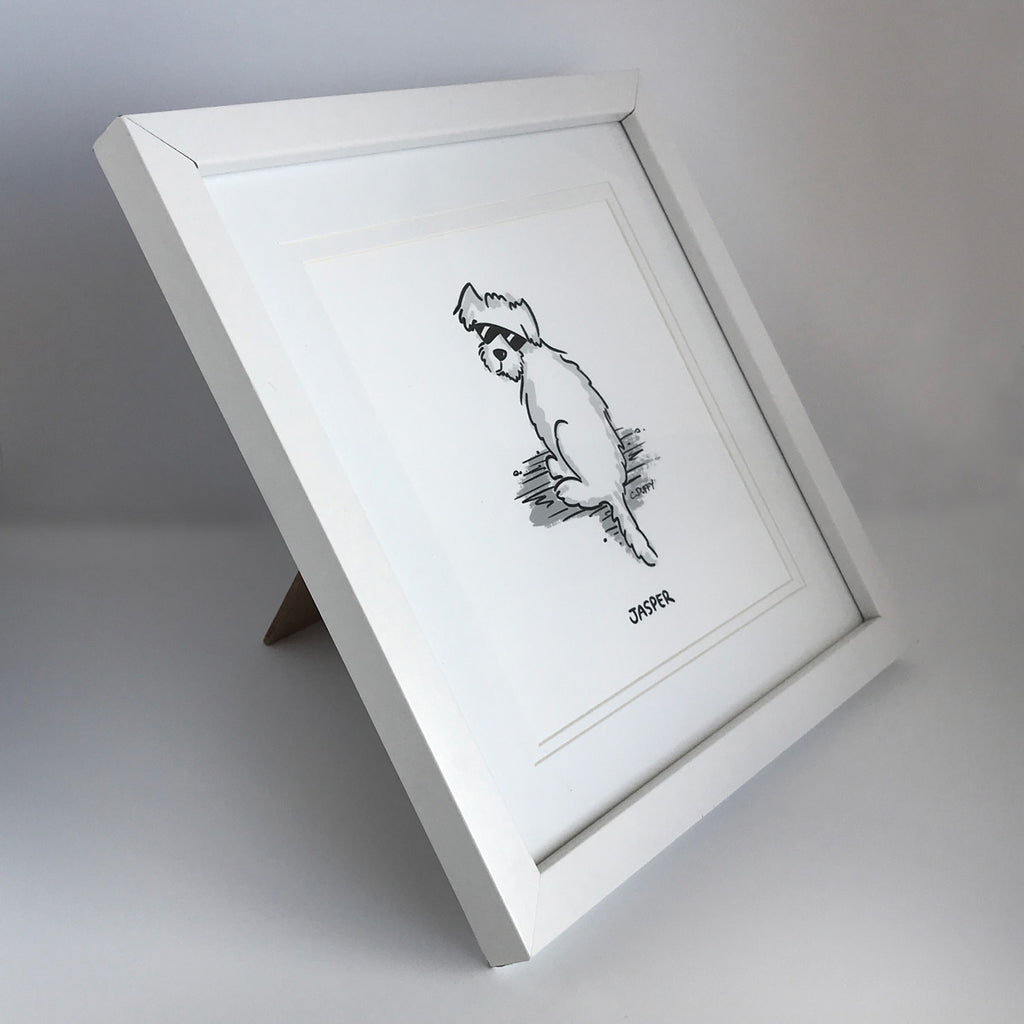 A white framed dog portrait featuring a cartoon dog Hound Town style by Clare Duffy