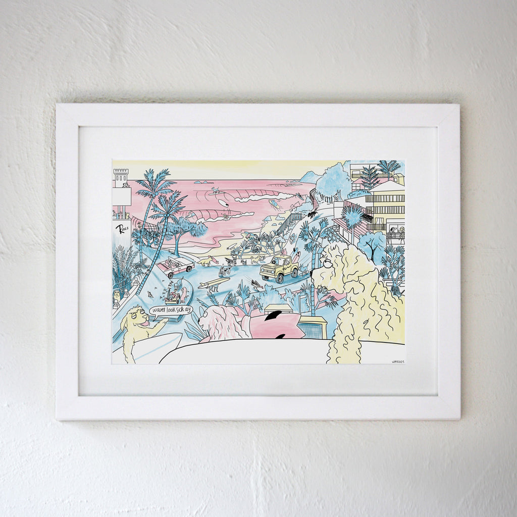 White framed artwork on a white wall featuring a Watego's scene from Byron Bay in the cartoon style of Clare Duffy featuring surfing dogs and a scene of the famous location 
